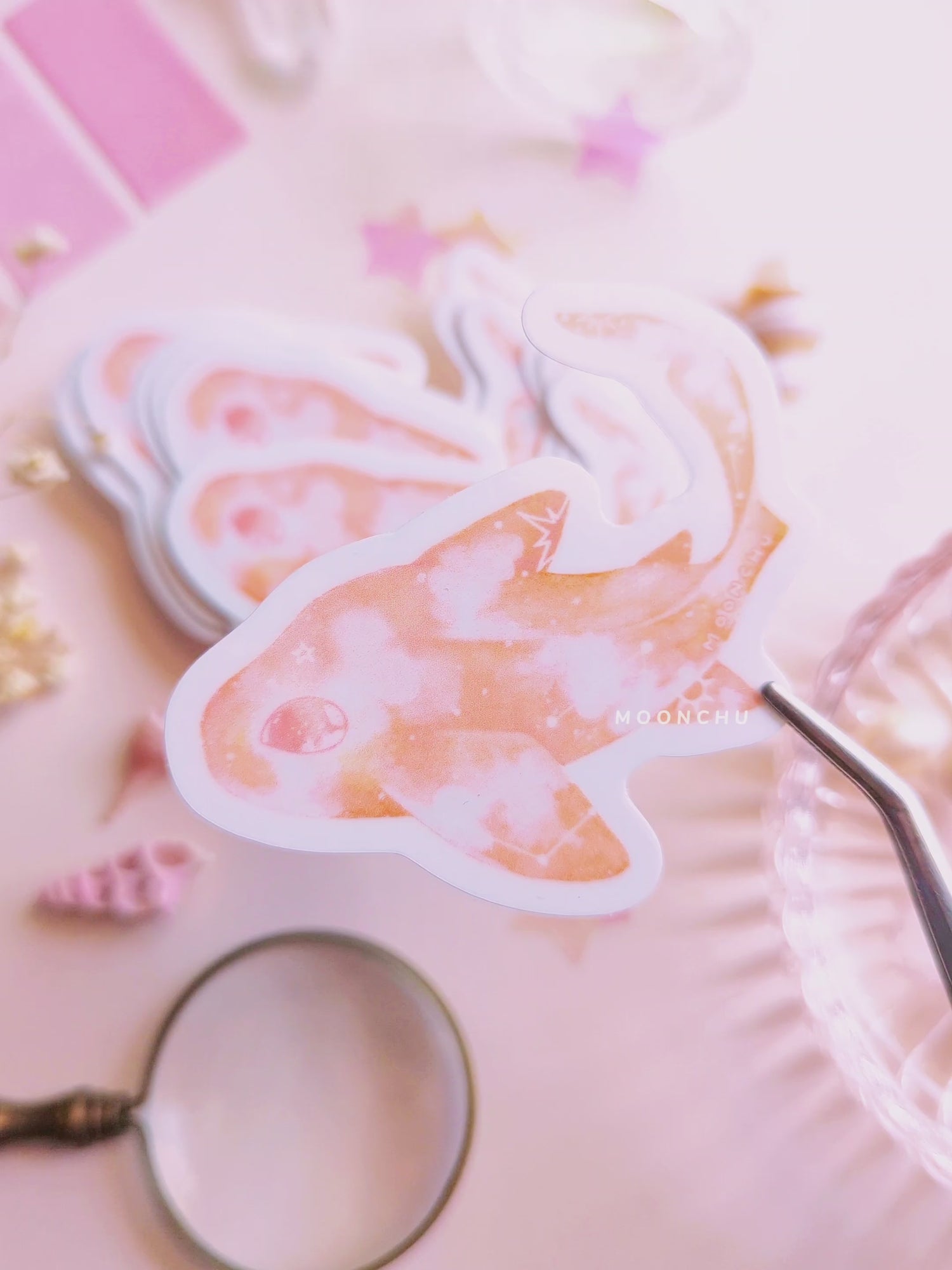 video showcases original illustration of a painted leopard shark by moonchu. very glossy vinyl sticker! pastel flatlay consists of other ocean items, like little shells and pearls. a high quality vinyl sticker for shark lovers or ocean gifts. perfect sticker for shark week.