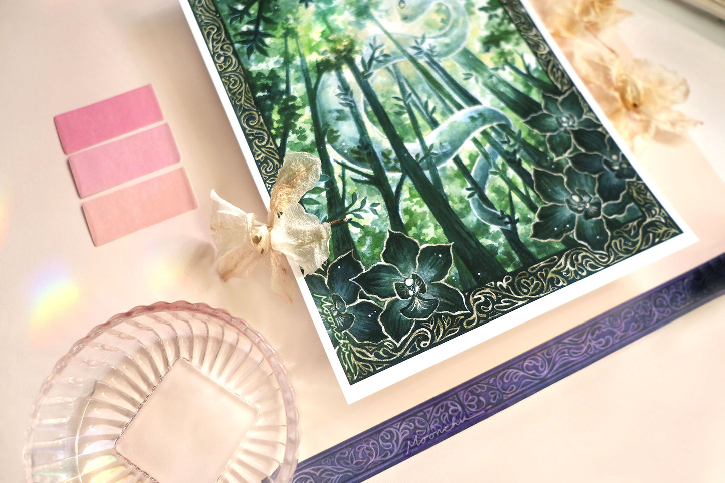 original mixed media art painting by moonchu depicting a lush, verdant snake winding through tall tree trunks. has an elaborate border with intricate dark green orchids framing the lower left and right. lunar new year art for growth inspiration, or if you are a snake lover or botanical friend. very green aesthetic, wooded forest illustration.