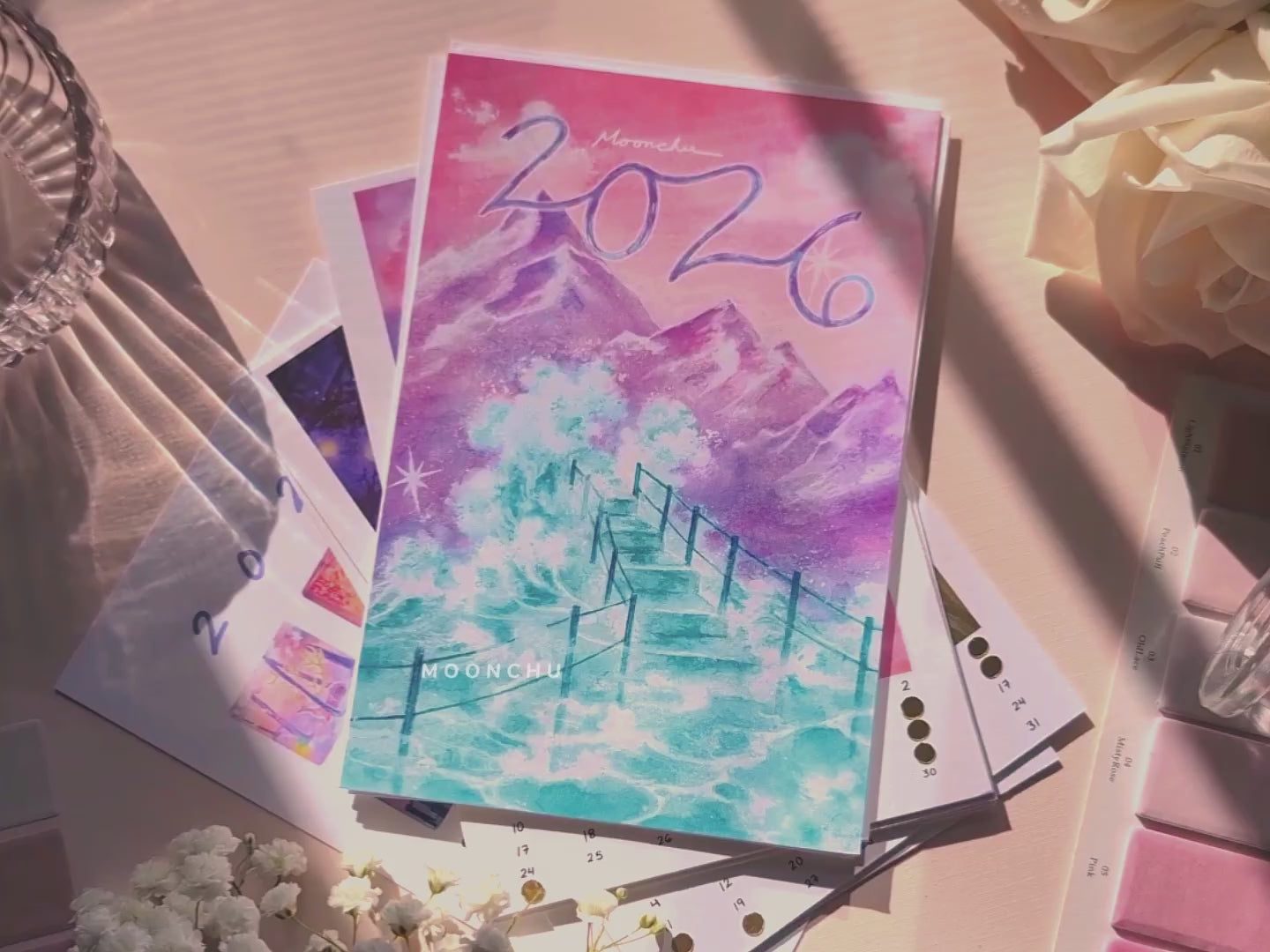video showing clips of the original illustration calendar for 2026 by moonchu. paintings inspired by nature with whimsical and sometimes subtly surreal elements. lots of soft, warm, sunny snippets. little video of the world's cutest cat at the end.