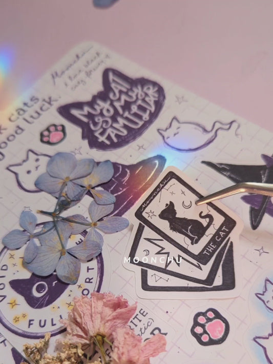 video showcases original sticker sheet illustration by moonchu of various black cat designs. printed upon recyclable paper, perfect for any halloween scrapbook or spooky journal page.
